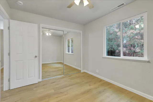 an aerial view of a house with a yard and a fountain