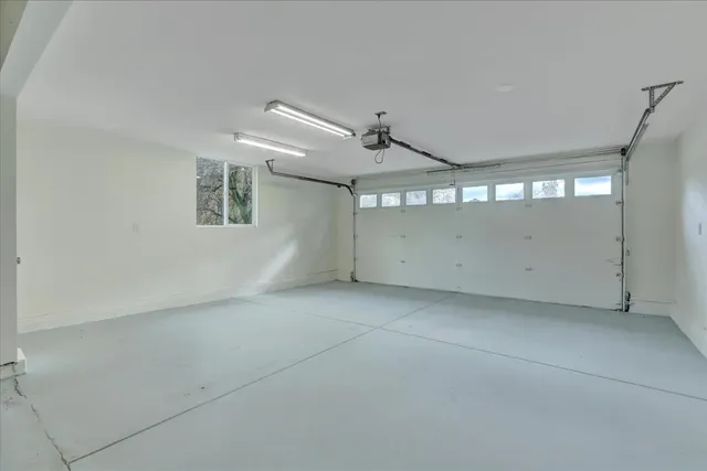 an aerial view of a house with a garden