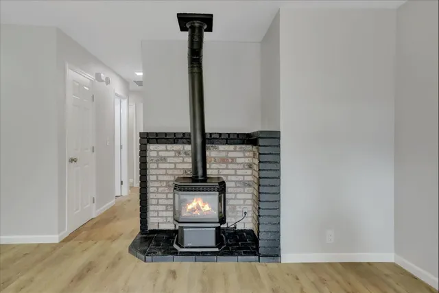 a kitchen with stainless steel appliances granite countertop a refrigerator a sink dishwasher a stove and a refrigerator