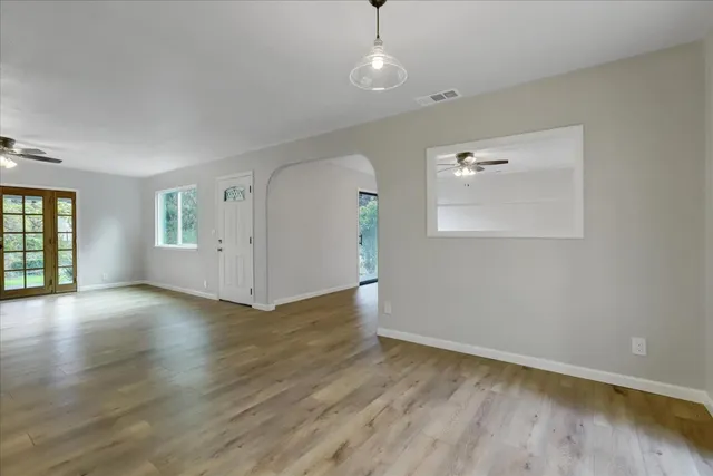 a kitchen with granite countertop a sink and cabinets