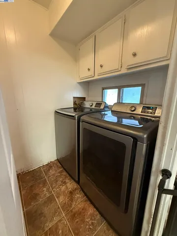 a stove top oven sitting inside of a kitchen