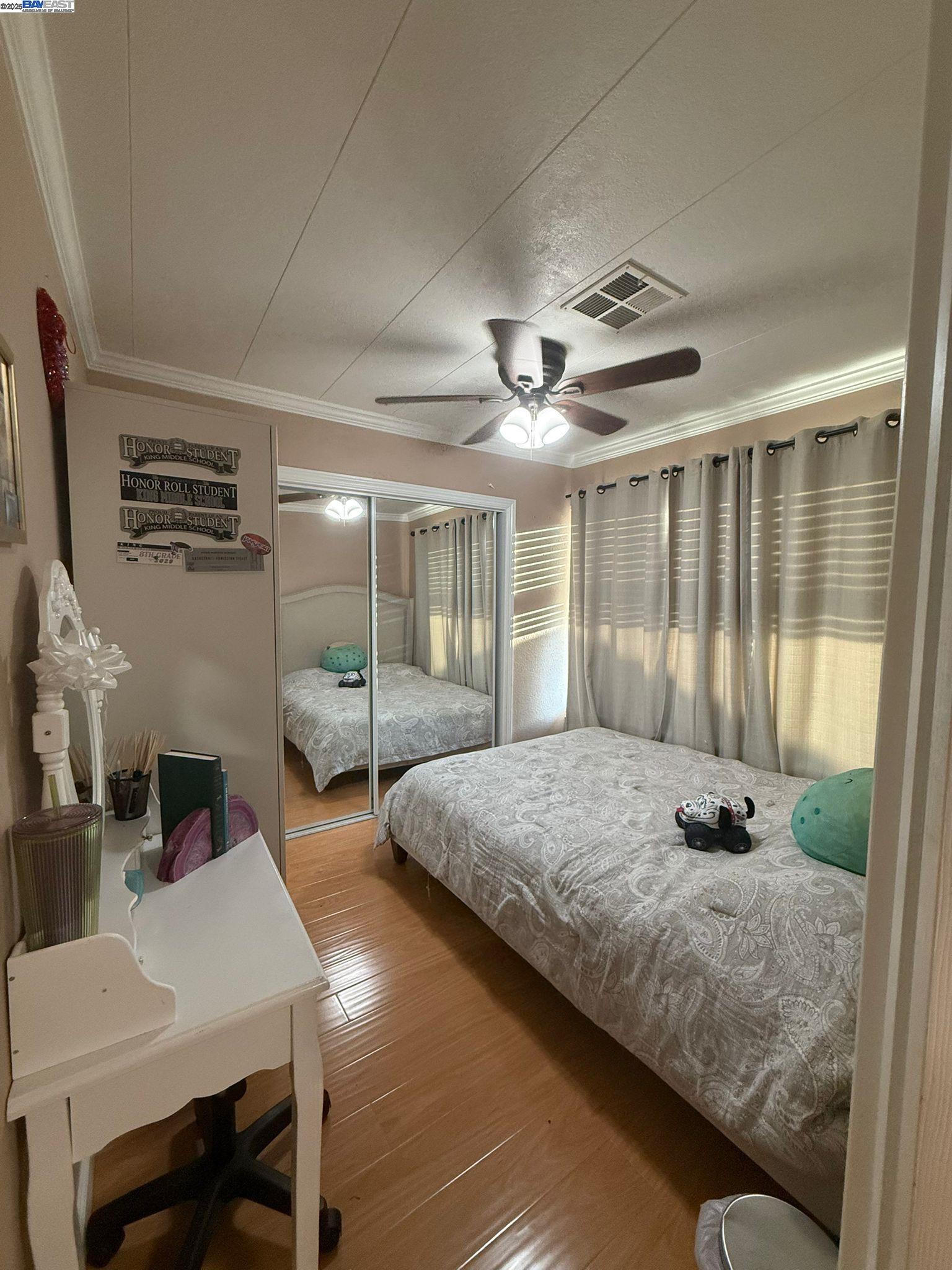 28290 Applegate Street Hayward, CA 94545 - Photo 14 of 20 a bedroom with bed mirror and window