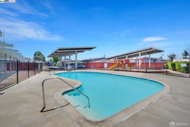 swimming pool with an outdoor seating