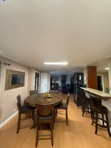 a view of a dining room with furniture and a livingroom