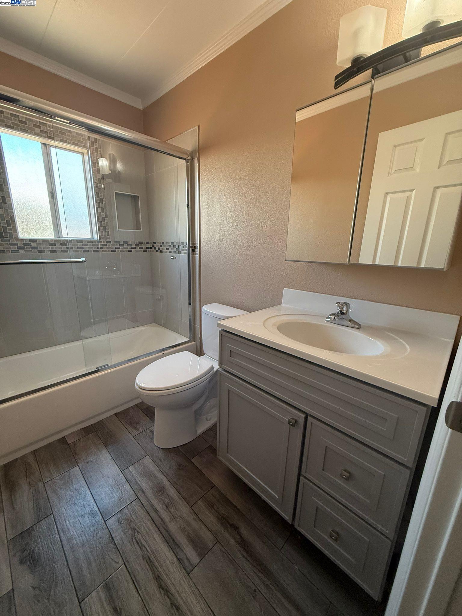 28290 Applegate Street Hayward, CA 94545 - Photo 5 of 20 a bathroom with a sink a toilet a mirror and shower