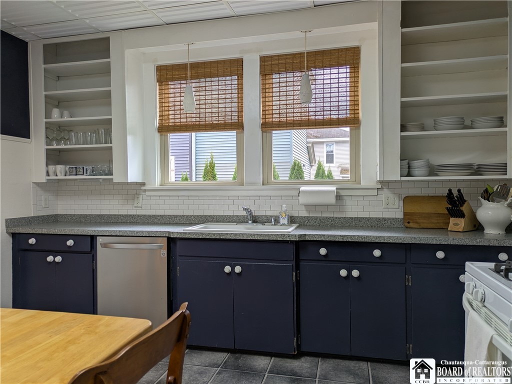 33 Maple Street Ellery, NY 14712 - Photo 8 of 40 Kitchen has a subway tile backsplash with shelving
