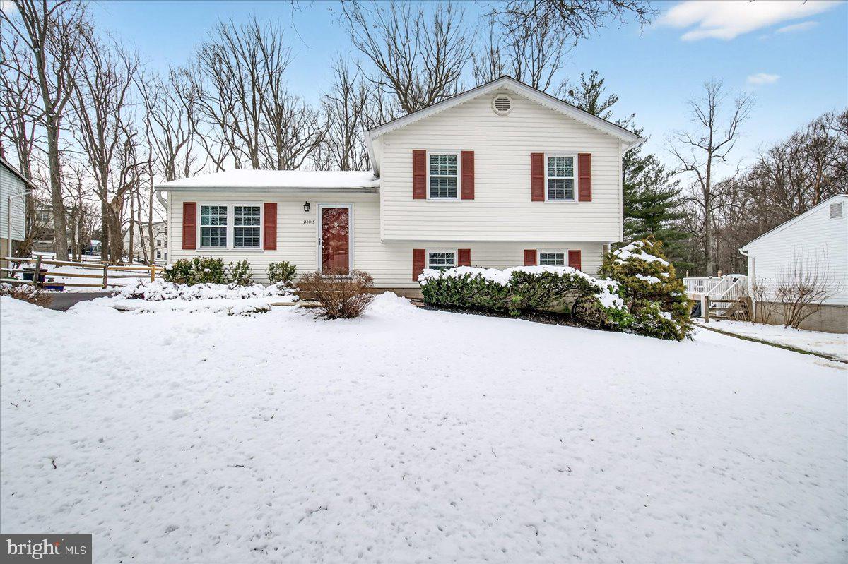 a front view of a house with yard and seating area