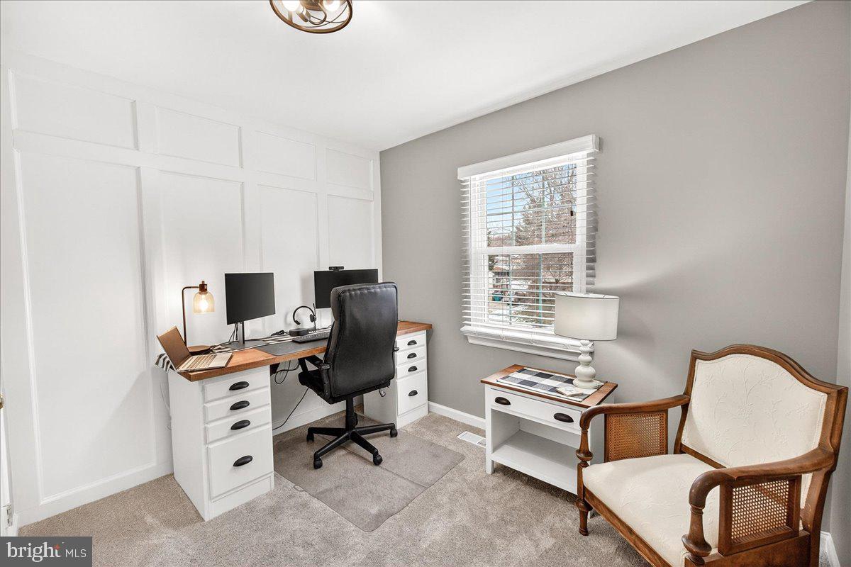 24013 Bush Hill Road Gaithersburg, MD 20882 - Photo 20 of 38 a view of a workspace with furniture and a window