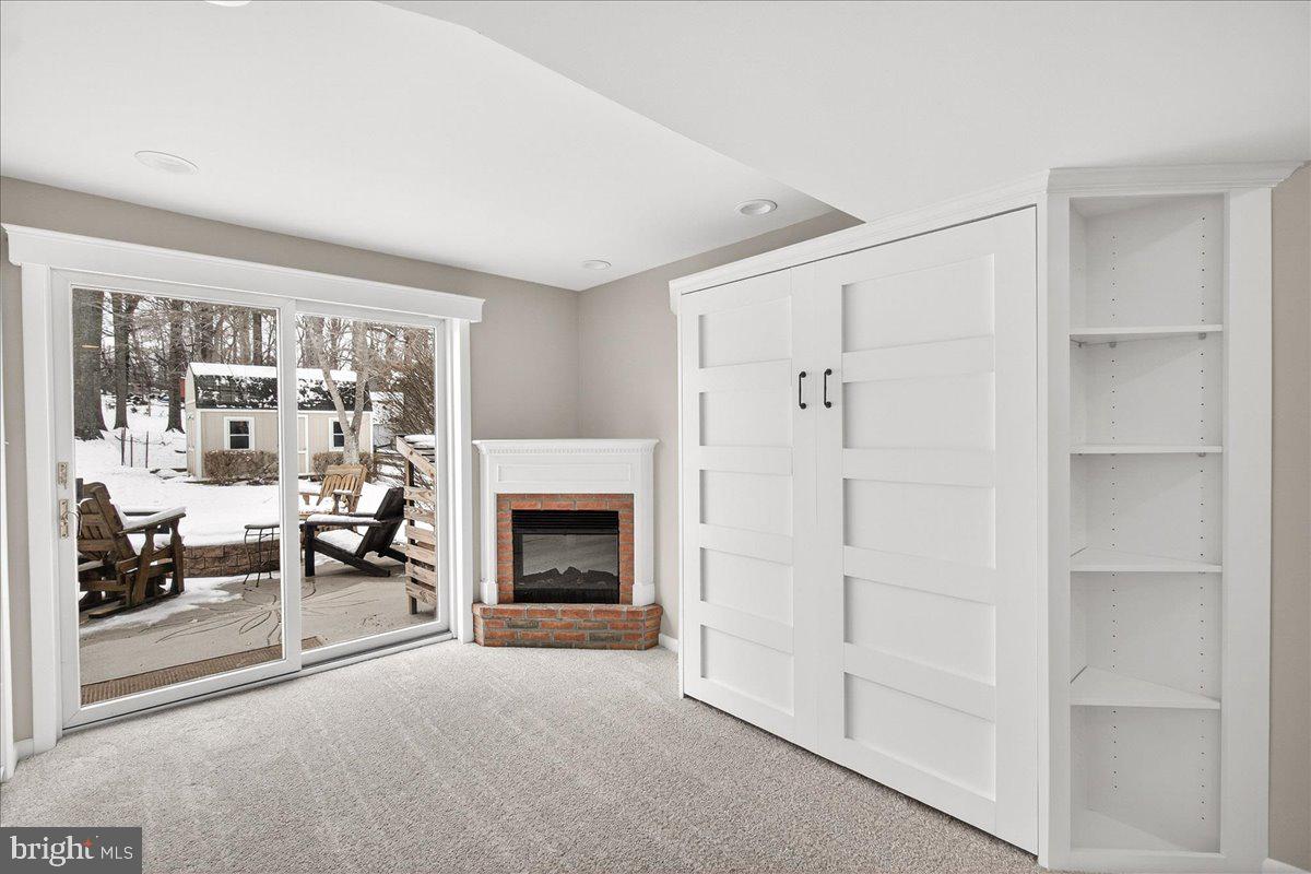 24013 Bush Hill Road Gaithersburg, MD 20882 - Photo 24 of 38 a living room with furniture and a fireplace