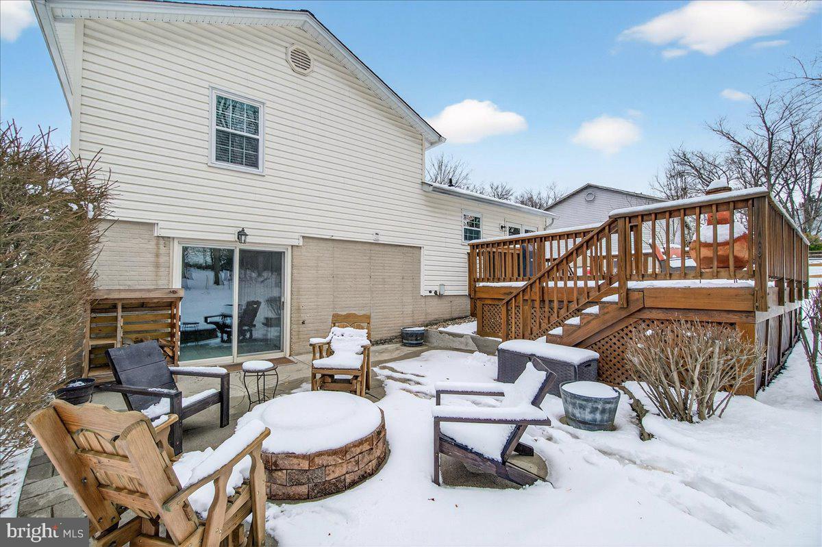 24013 Bush Hill Road Gaithersburg, MD 20882 - Photo 29 of 38 a building outdoor space with patio furniture and potted plants