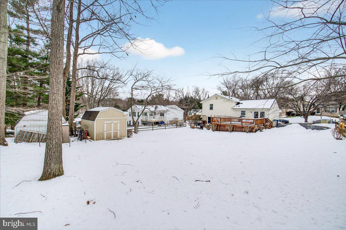 24013 Bush Hill Road Gaithersburg, MD 20882 - Photo 34 of 38 a view of the road with a building