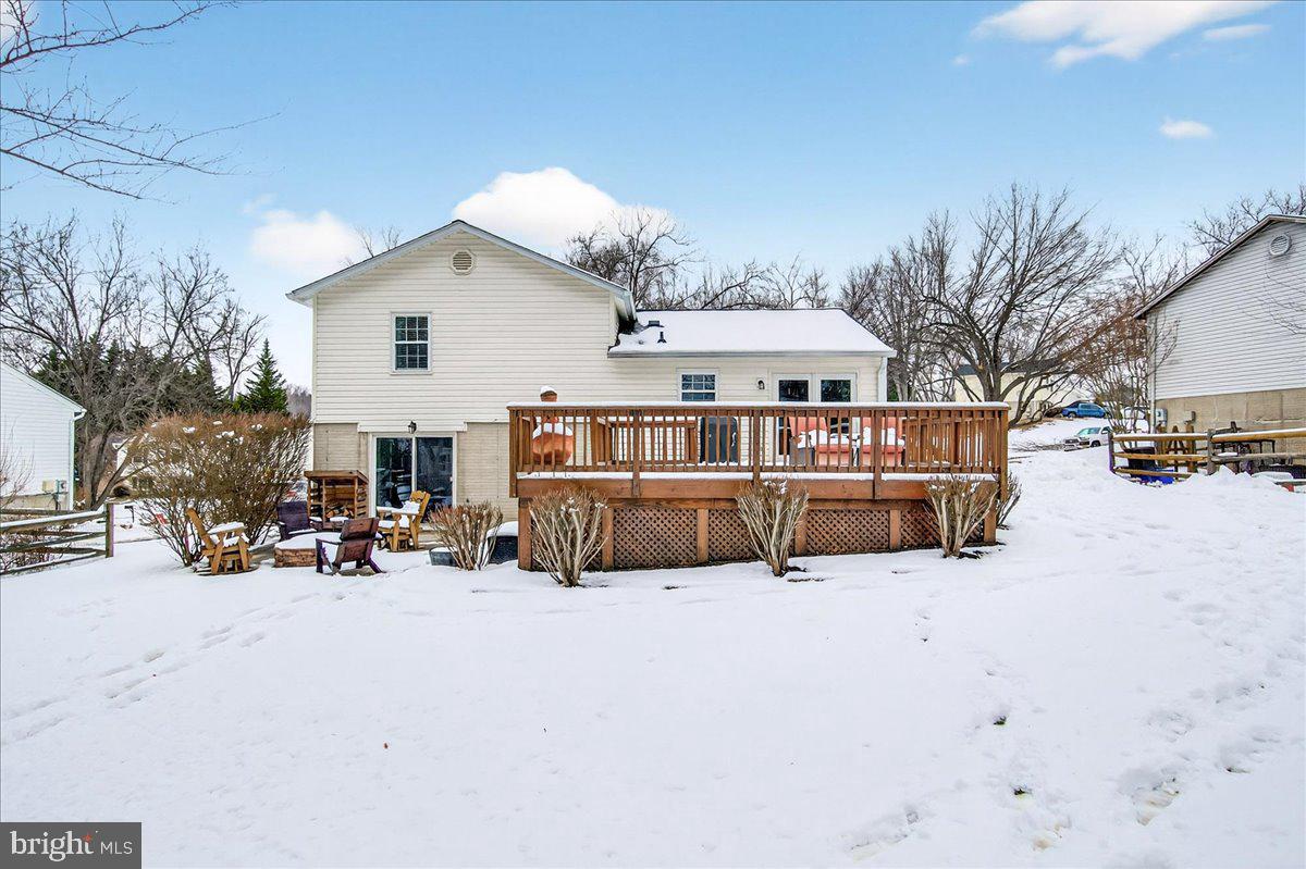24013 Bush Hill Road Gaithersburg, MD 20882 - Photo 38 of 38 a view of a house with a snow in the yard