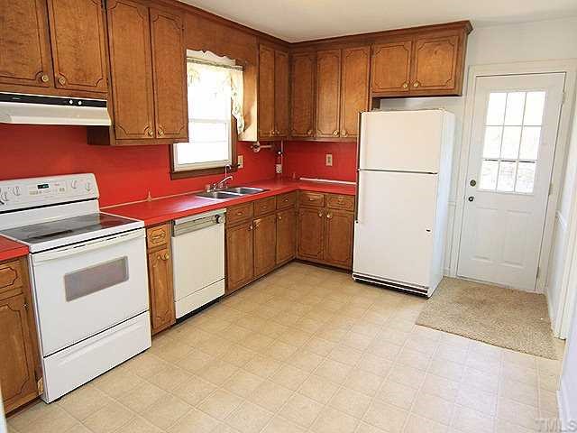 530 Andover Road Durham, NC 27712 - Photo 4 of 12 a kitchen with cabinets appliances a sink and a window