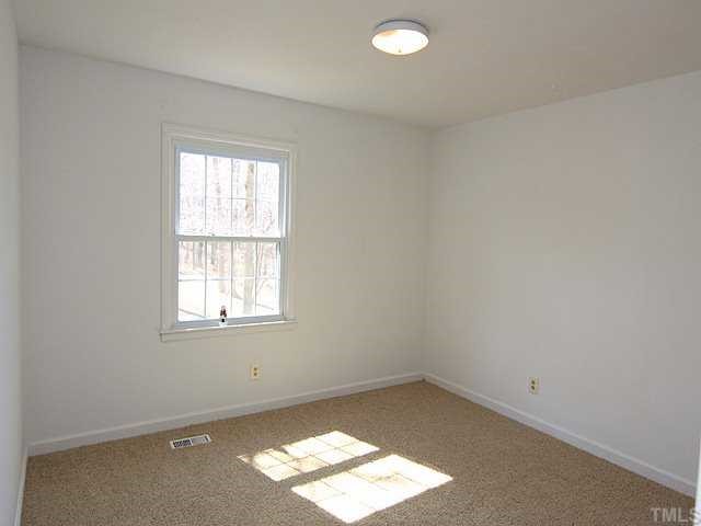 530 Andover Road Durham, NC 27712 - Photo 8 of 12 an empty room with a window