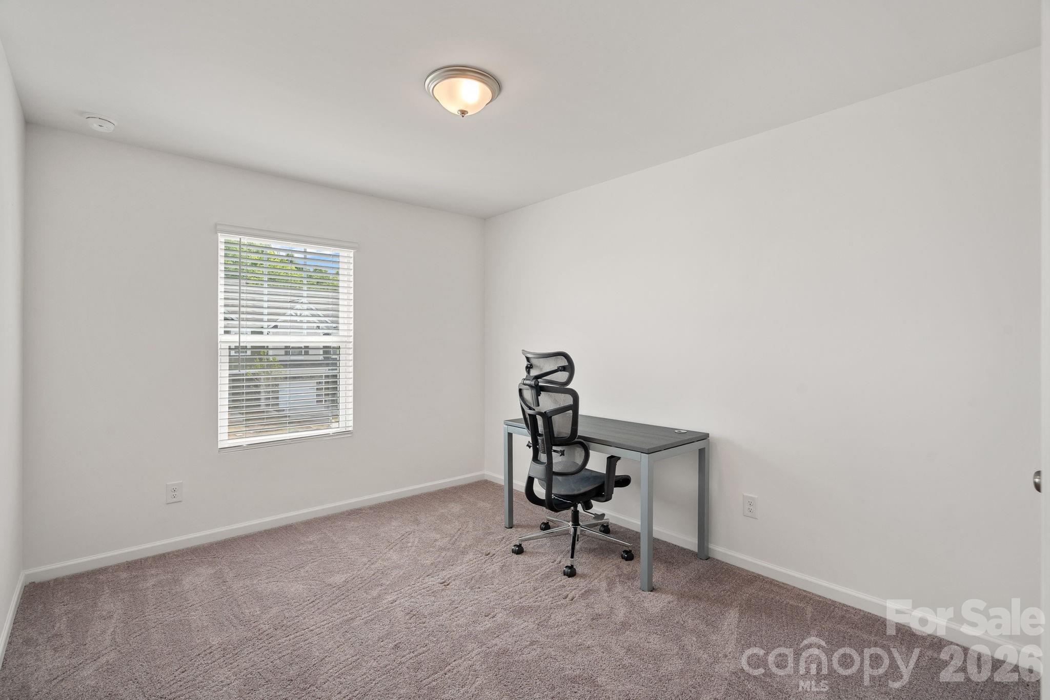 3579 Nimbell Road Monroe, NC 28110 - Photo 20 of 24 a view of a room with a window and chair