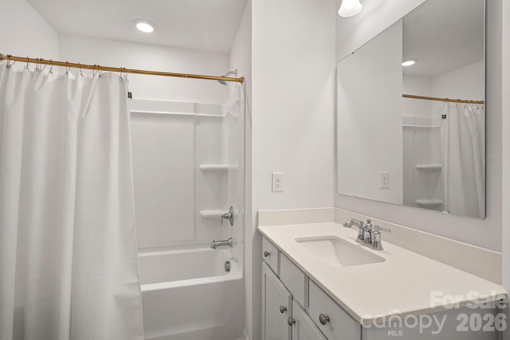 3579 Nimbell Road Monroe, NC 28110 - Photo 21 of 24 a bathroom with a sink double vanity mirror and a bathtub