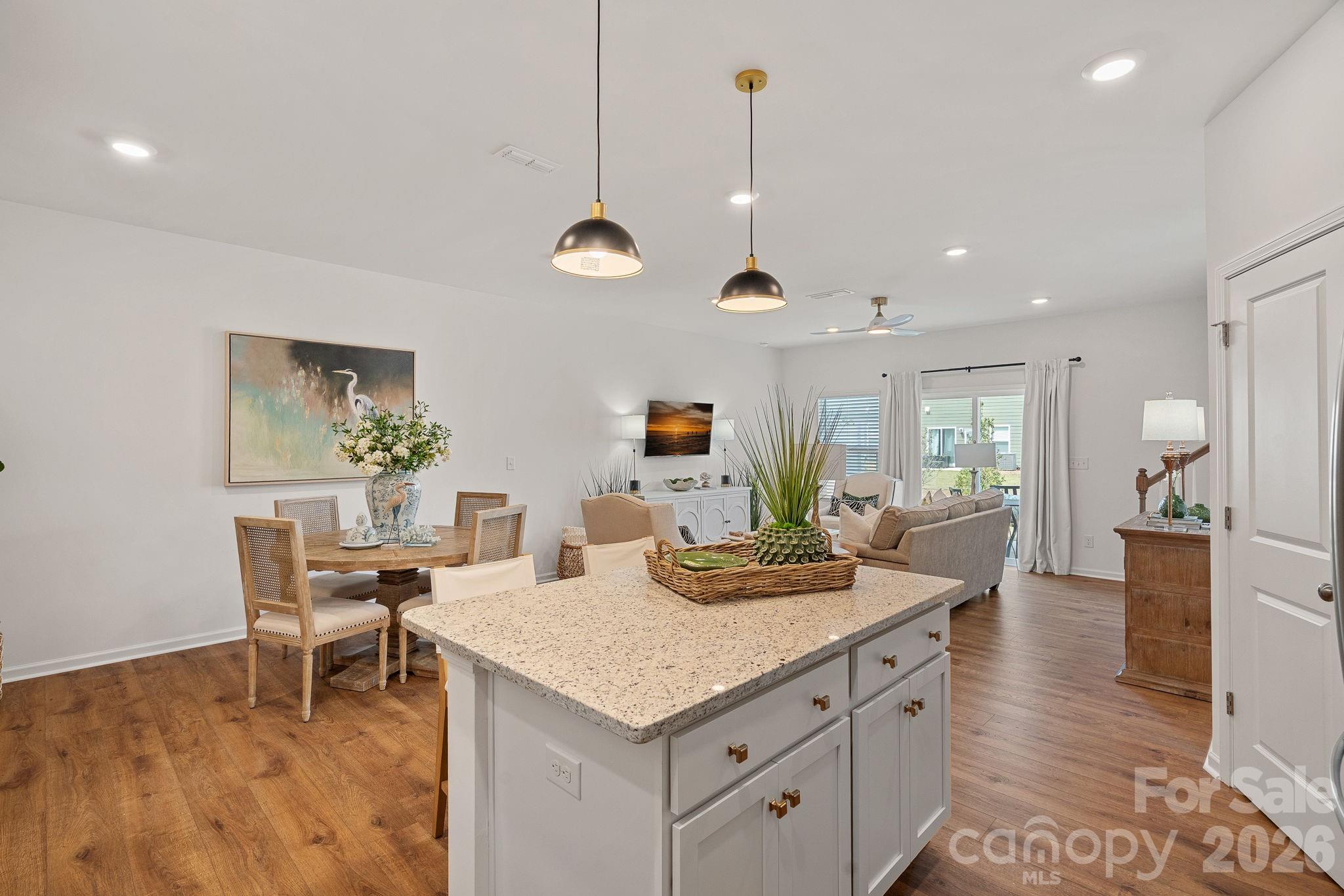 3579 Nimbell Road Monroe, NC 28110 - Photo 6 of 24 a living room with furniture kitchen view and a wooden floor