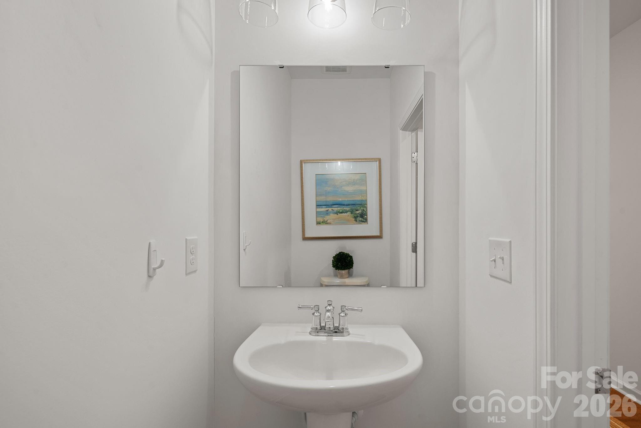 3579 Nimbell Road Monroe, NC 28110 - Photo 9 of 24 a bathroom with a sink and a mirror