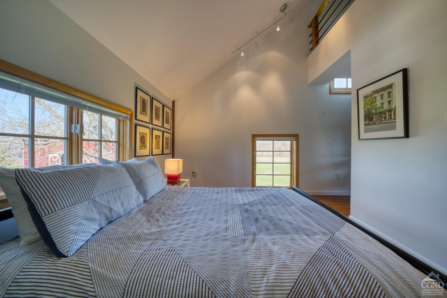 261 Kipp Road Hudson, NY 12534 - Photo 23 of 36 a bedroom with a large bed and a window