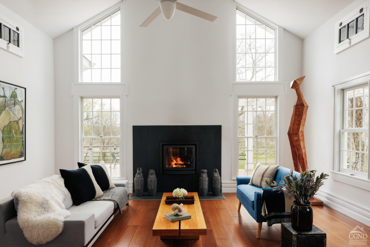261 Kipp Road Hudson, NY 12534 - Photo 7 of 36 a living room with furniture fireplace and a large window