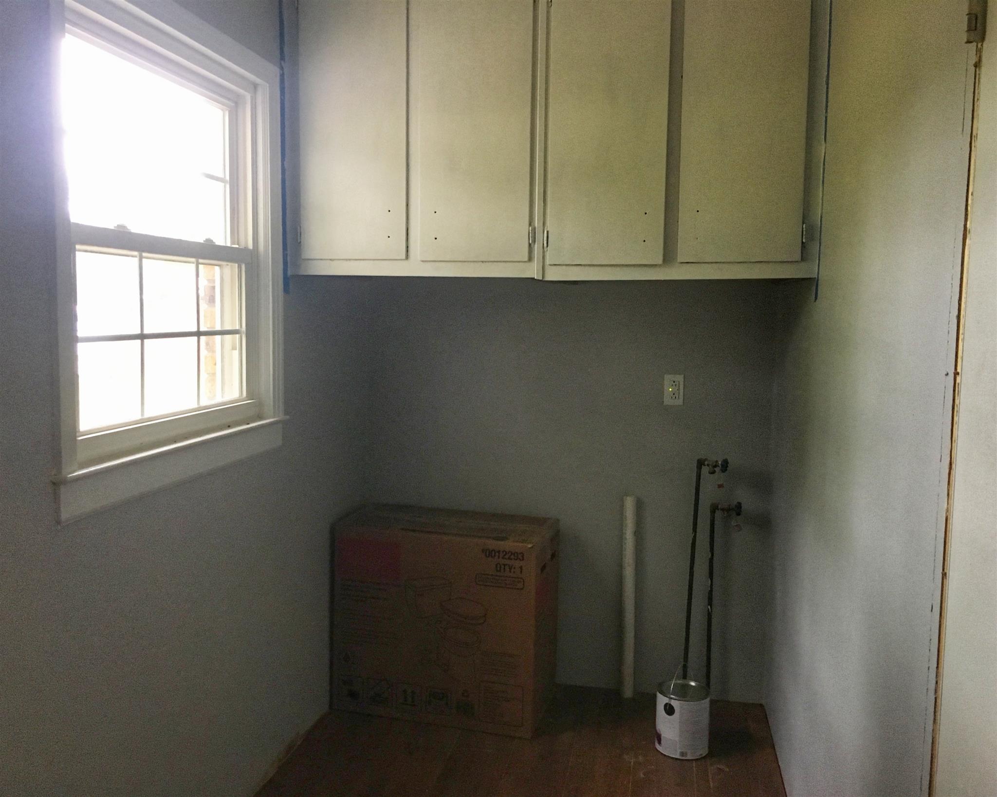 1526 Murfreesboro Road Lebanon, TN 37090 - Photo 6 of 11 The utility room, located conveniently off the kitchen, serves as a half bath that is easily accessible from the work-space in the garage.