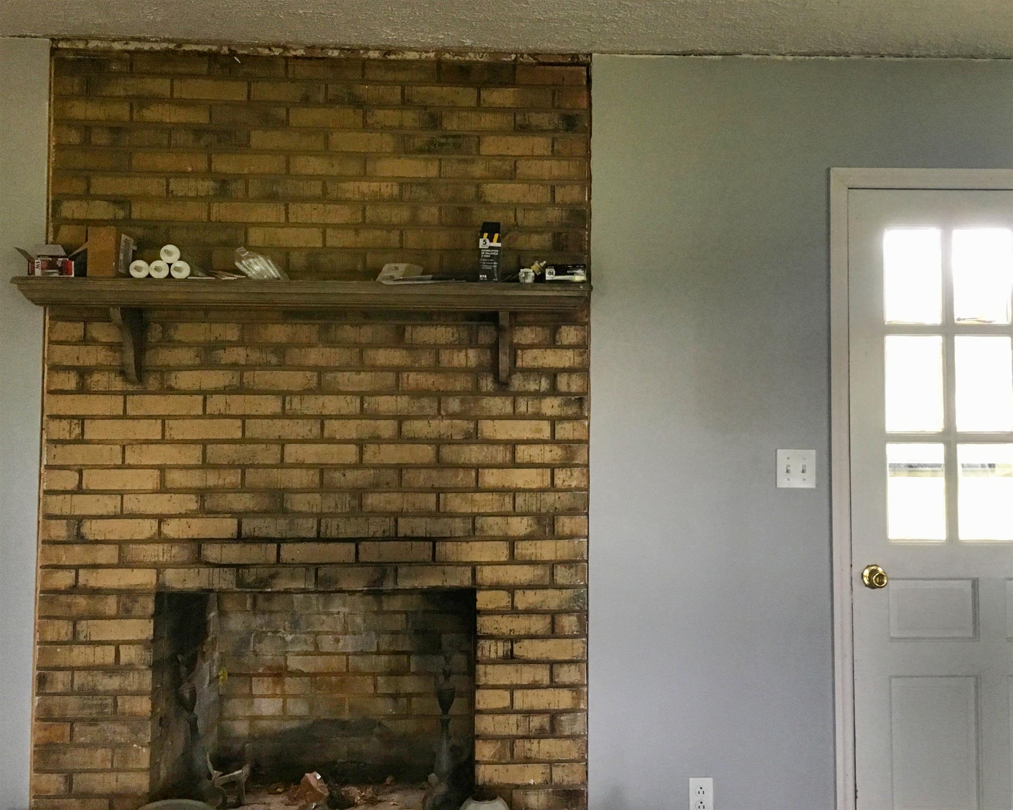 1526 Murfreesboro Road Lebanon, TN 37090 - Photo 7 of 11 The ongoing renovations will use modern trim to showcase the living space's fireplace.