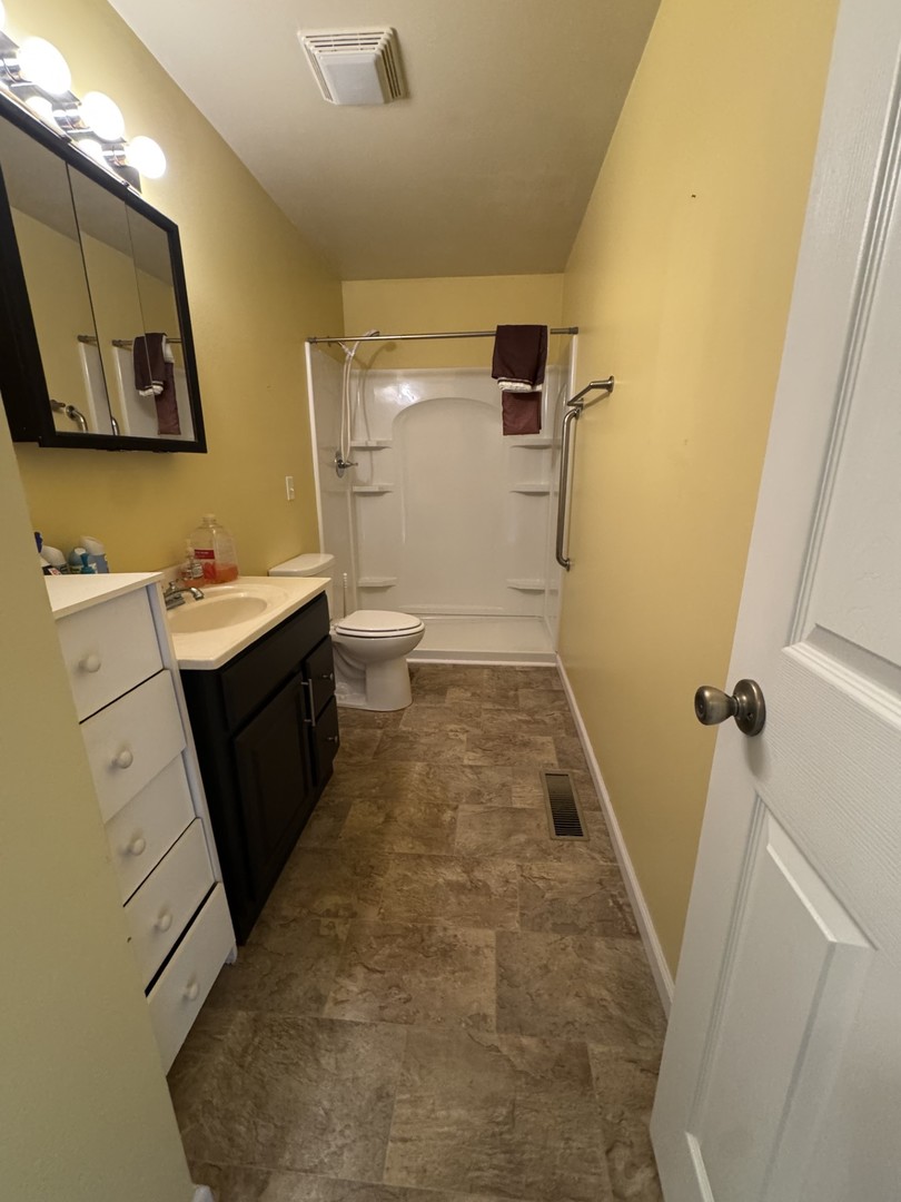 1908 22nd Avenue Sterling, IL 61081 - Photo 11 of 11 a bathroom with a sink and a mirror