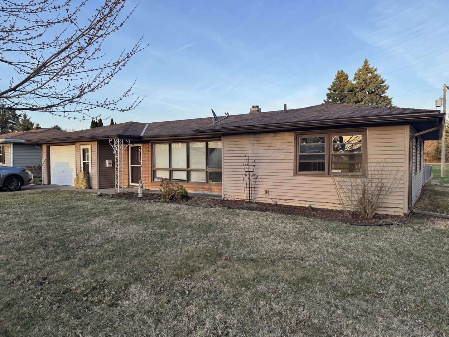 1908 22nd Avenue Sterling, IL 61081 - Photo 3 of 11 a front view of a house with a yard