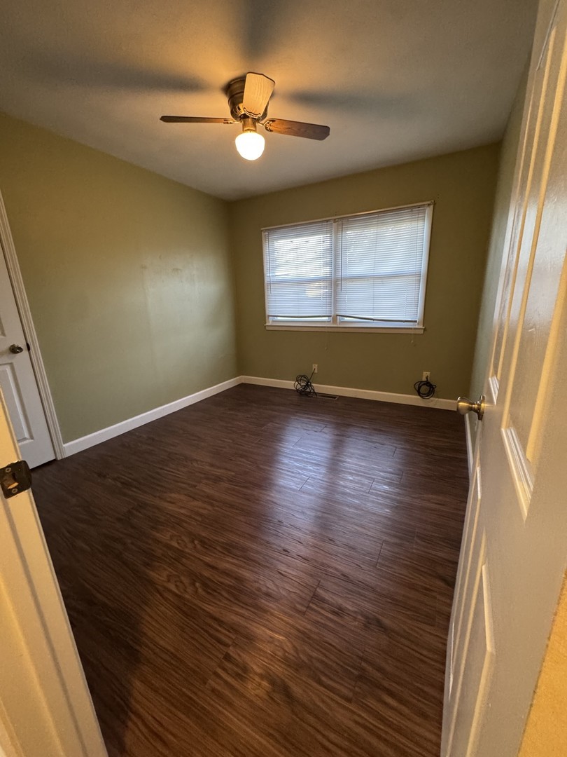 1908 22nd Avenue Sterling, IL 61081 - Photo 10 of 11 an empty room with wooden floor and windows