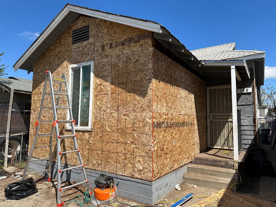 148 E Street Fresno, CA 93706 - Photo 12 of 13 a front view of a house with parking area