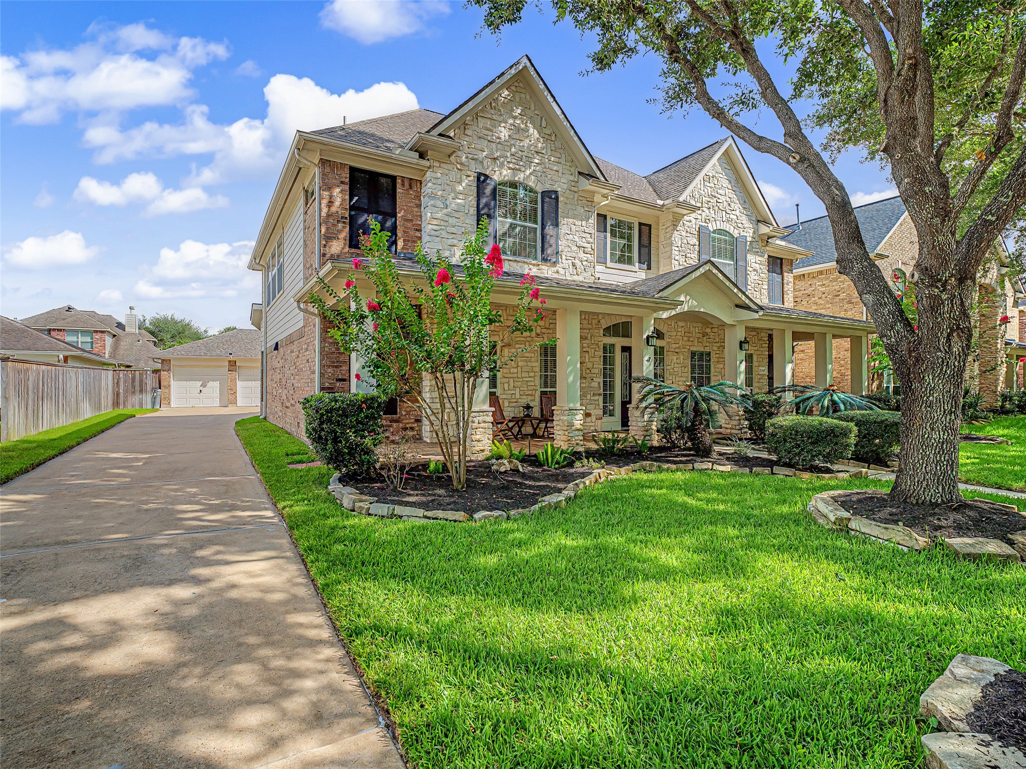 2210 Fox Path Katy, TX 77494 - Photo 3 of 47 This expansive, extended driveway offers an abundance of off-street parking for guests, a safe and wide area for kids to ride scooters or play basketball, and seamless access to the rear of the property.