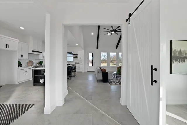 a view of a living room and entry way