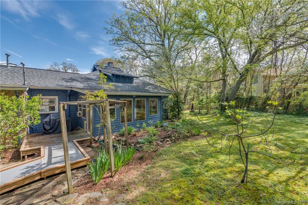 290 New Market Road Tryon, NC 28782 - Photo 22 of 25 a view of a house with backyard and sitting area