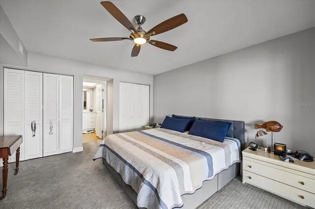 a bedroom with bed and window