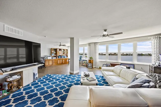 a kitchen with stainless steel appliances granite countertop a sink and refrigerator