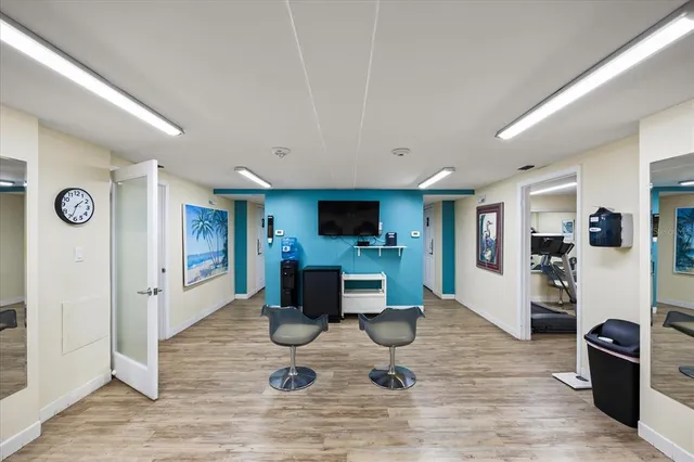 a view of a swimming pool with outdoor seating