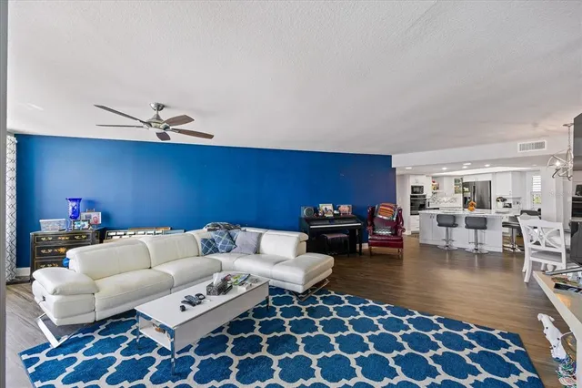 a bedroom with furniture and a wooden floor