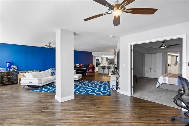 a view of a dining room with furniture and wooden floor