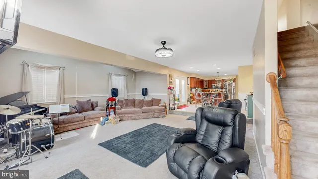a bathroom with a tub a sink and a large mirror