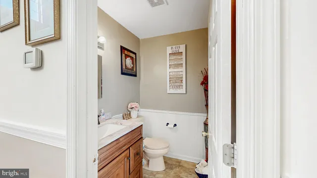a sitting area with furniture on wooden deck