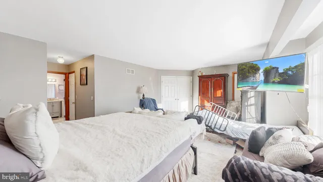 a view of a terrace with wooden floor and outdoor seating