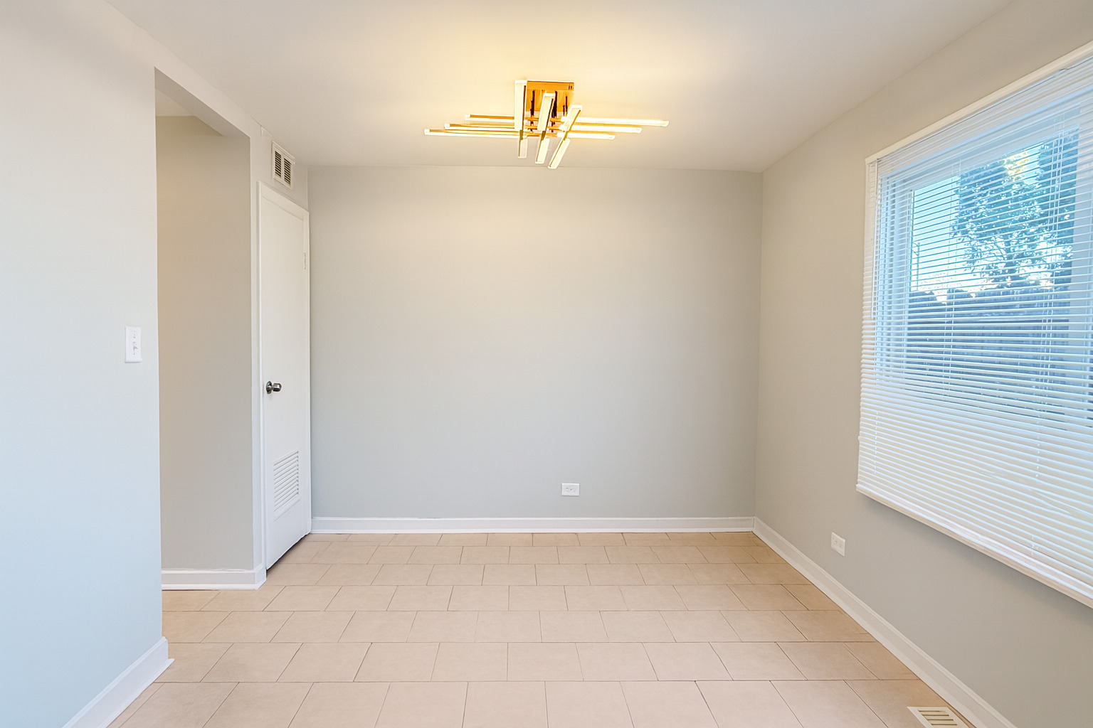 1272 Court, Unit E Hanover Park, IL 60133 - Photo 3 of 13 a view of a room with a window