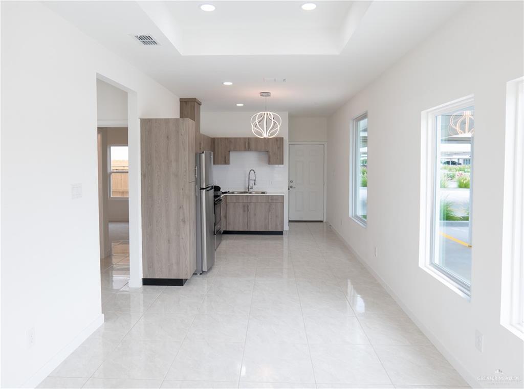 5325 Vision Street, Unit A Rio Grande City, TX 78582 - Photo 5 of 8 a view of kitchen with refrigerator and window