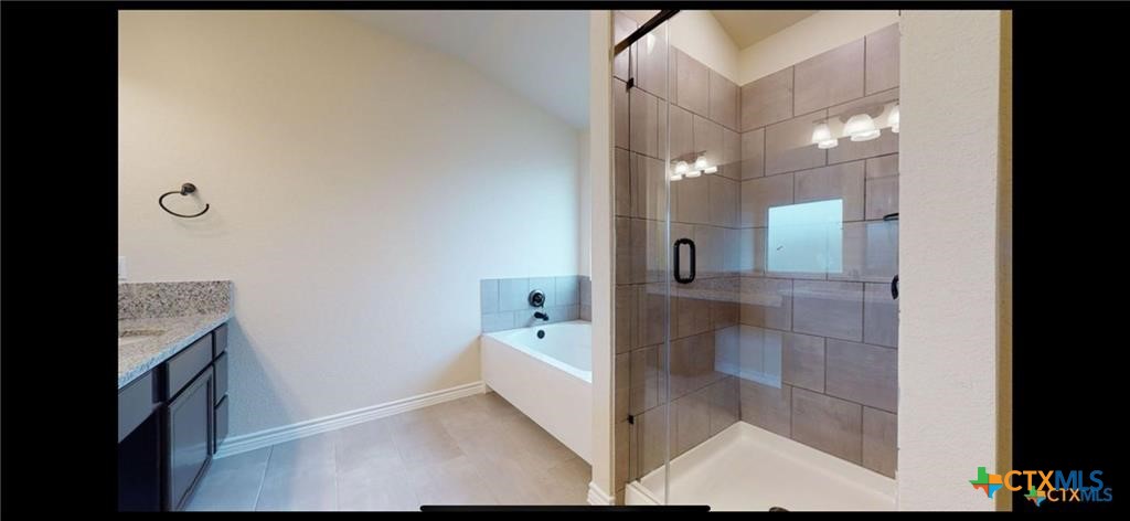 1311 Roma Street Harker Heights, TX 76548 - Photo 6 of 8 a bathroom with a sink a toilet and shower