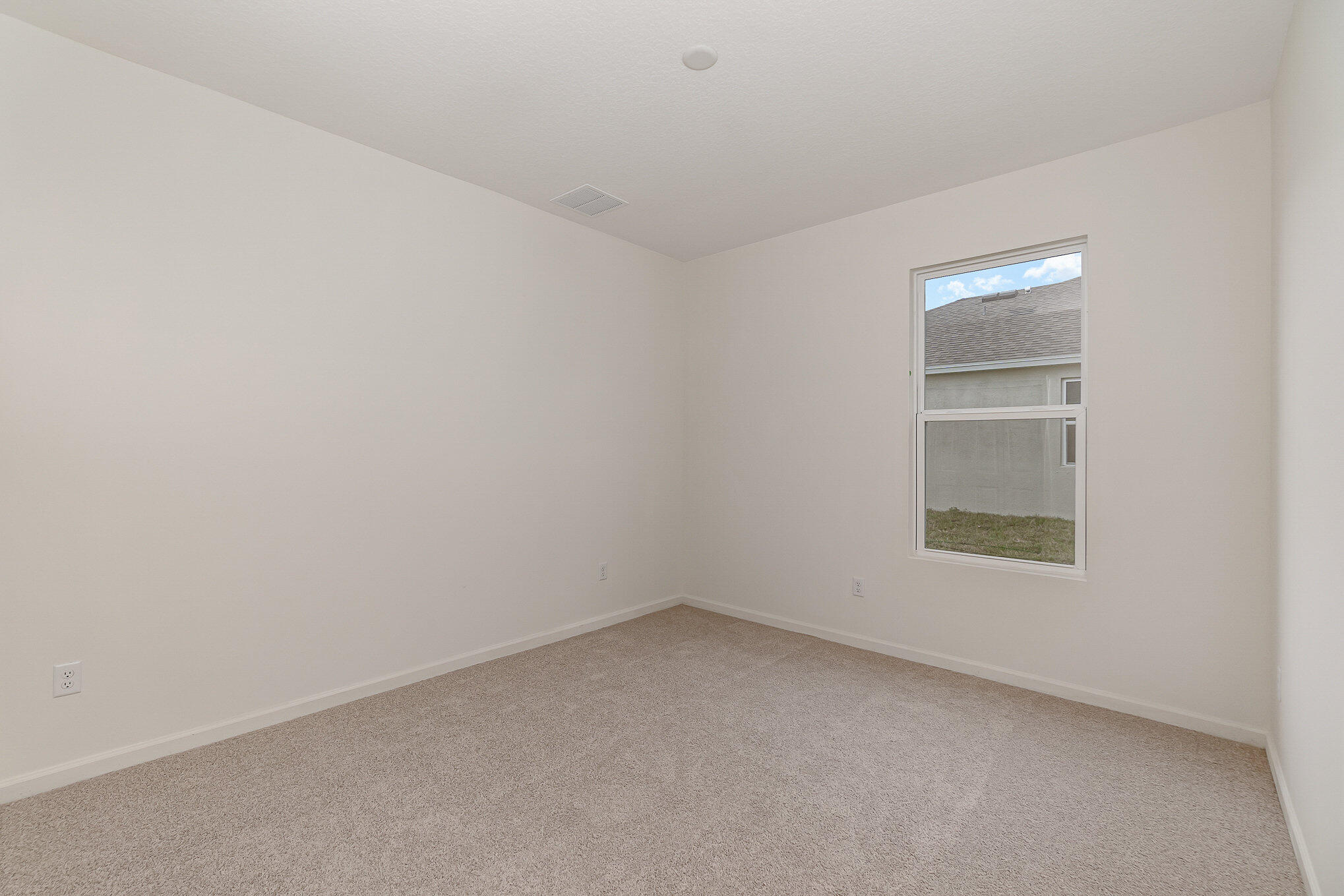 4842 Alabaster Drive Grant, FL 32949 - Photo 16 of 47 an empty room with a window