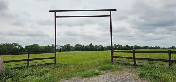 a view of park with a fence