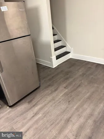 a white toilet sitting next to a sink and vanity
