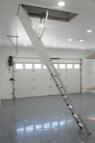 a view of a patio with table and chairs under an umbrella