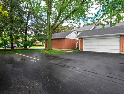 a view of a house with a street