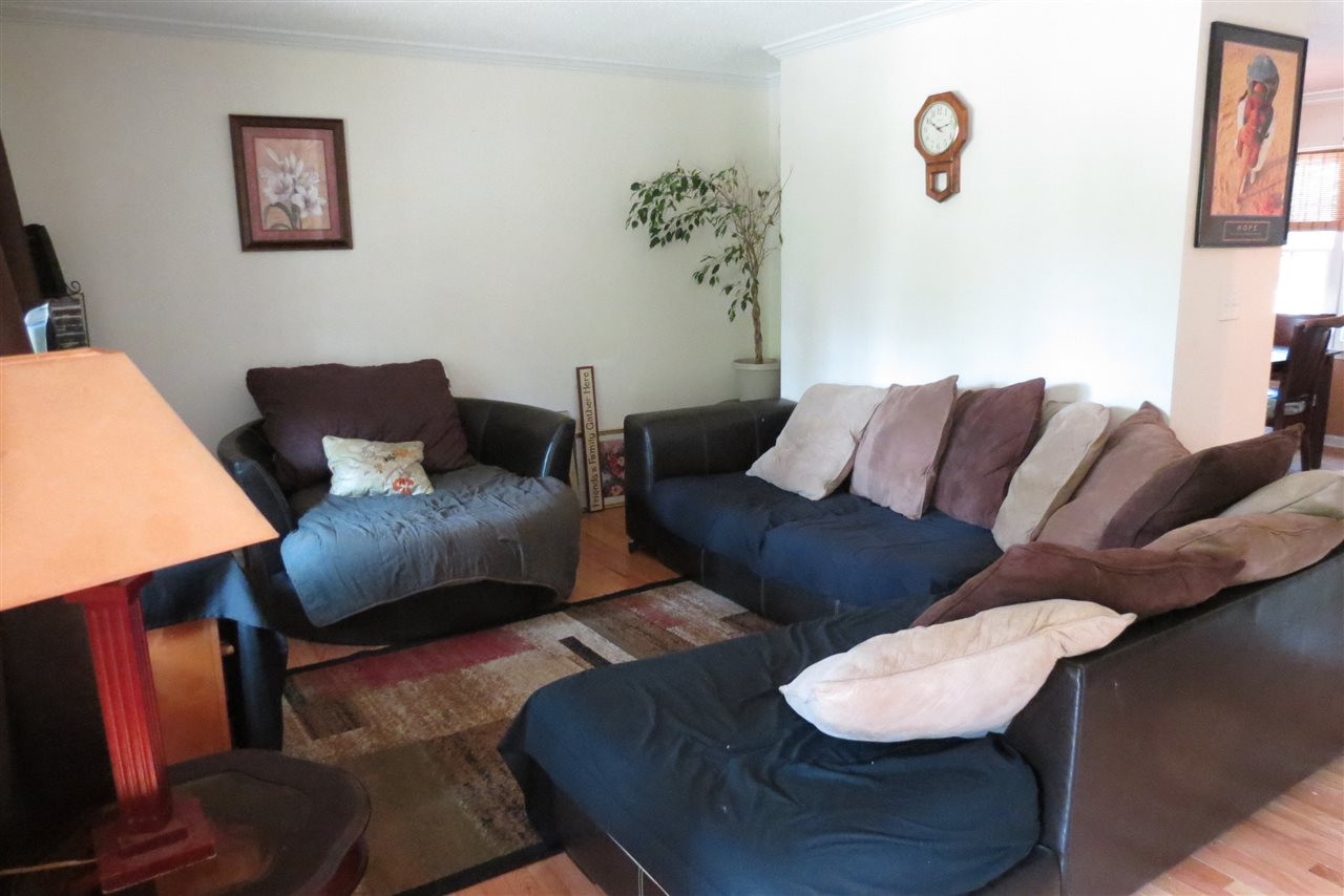 5114 McCormick Road Durham, NC 27713 - Photo 13 of 25 a living room with furniture and wooden floor